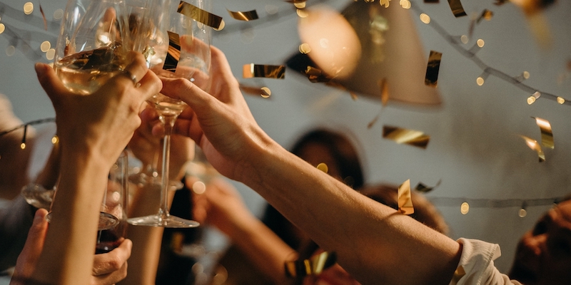 most-admired-companies-az people celebrating holding up champagne glasses